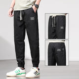 LUTAOTIE Sports Trousers Men's Loose Tappered Men's Pants  Spring and Summer New All-Matching Fashion Brand Tooling Casual Pants Men